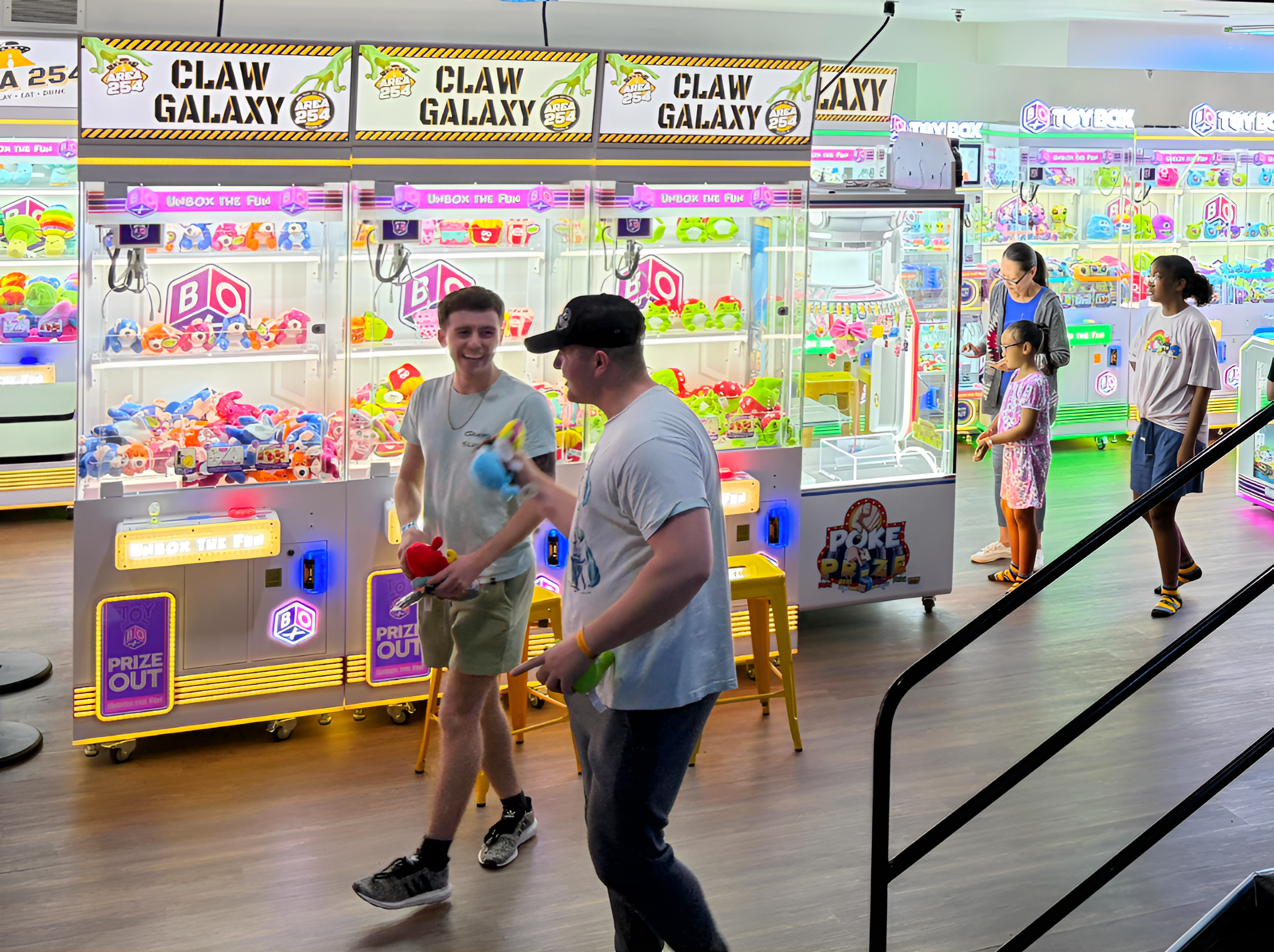 kids playing with claw machine
